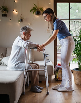 Caregiver helping elderly person